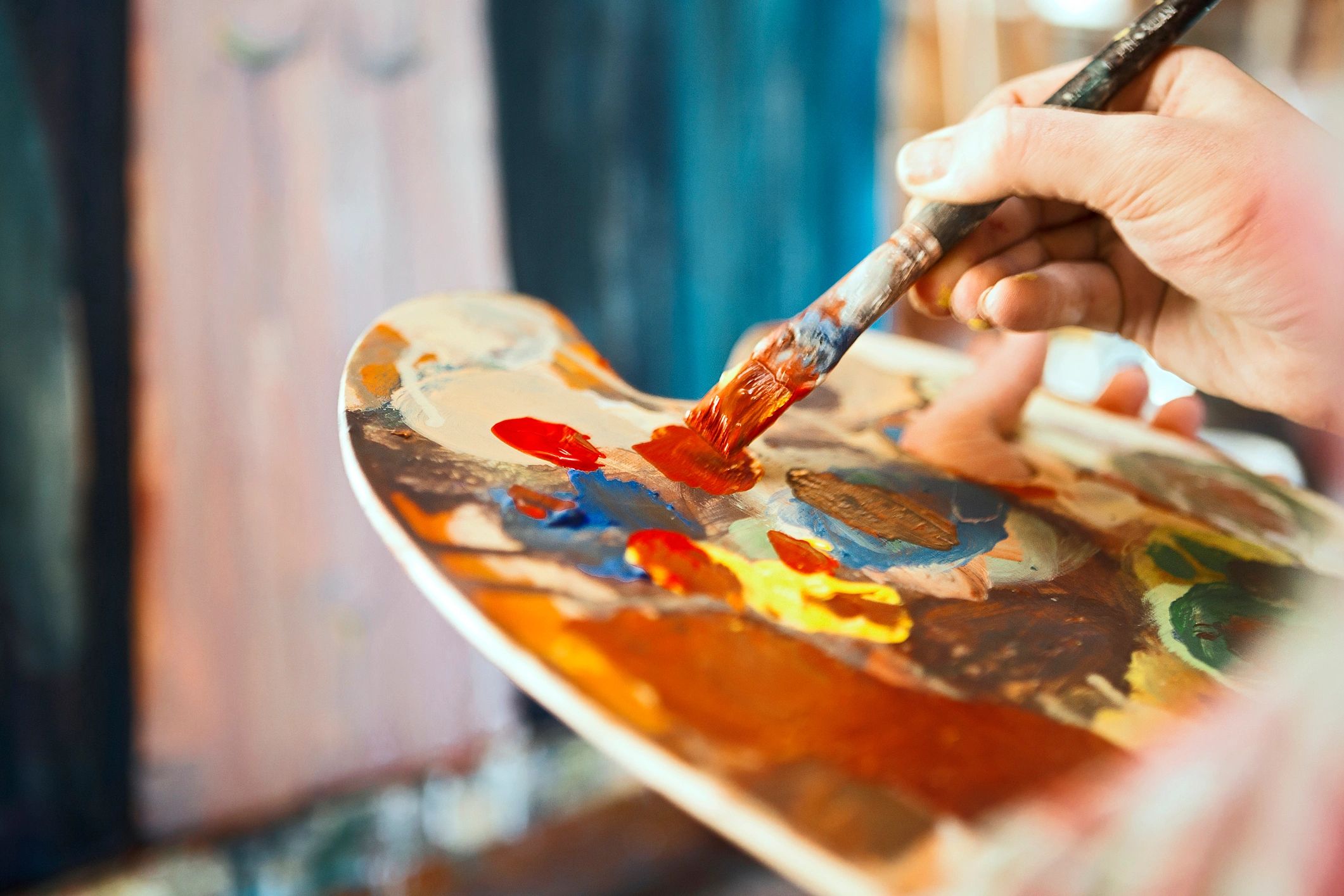 Artist painting in studio