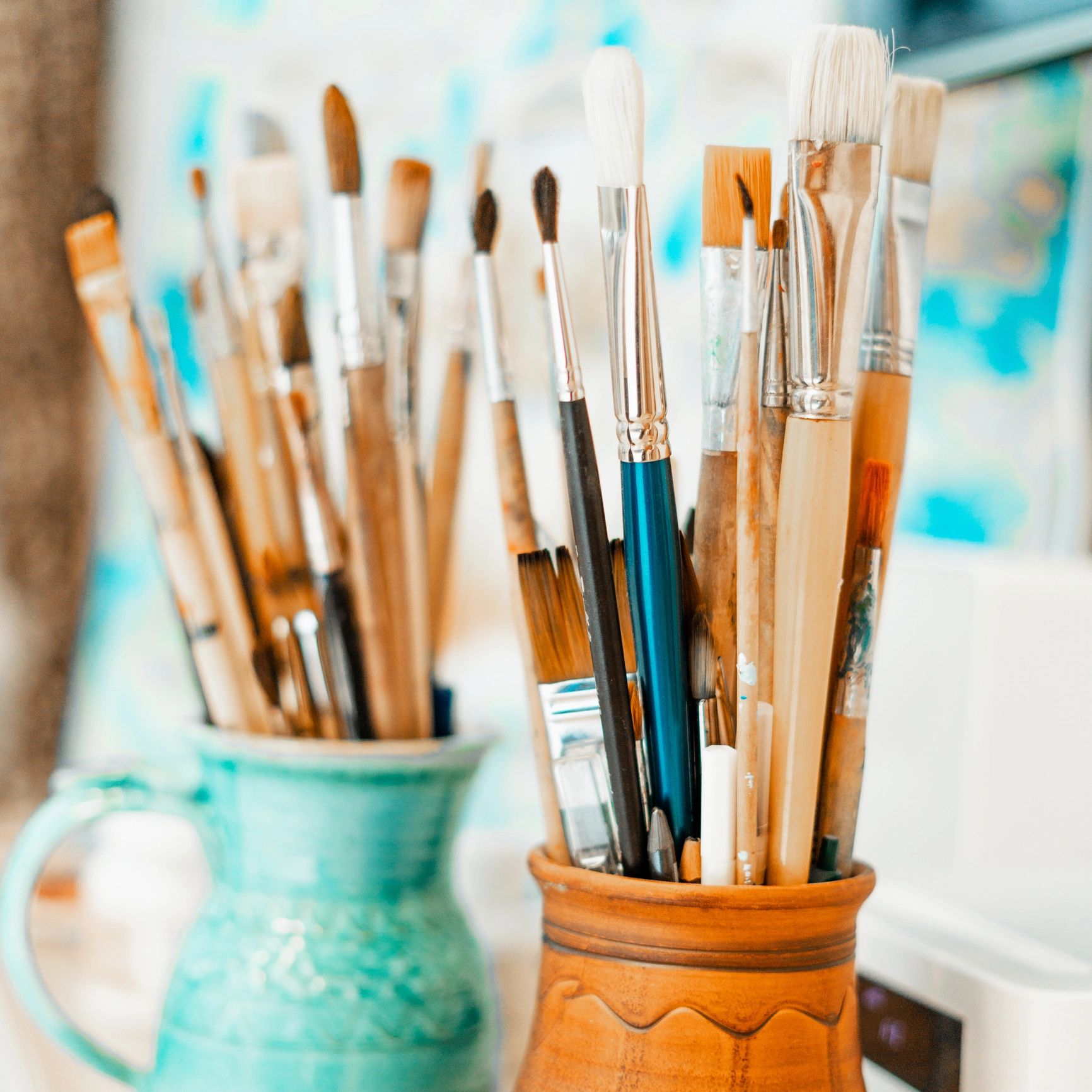 Artist palette and brushes in blue tones
