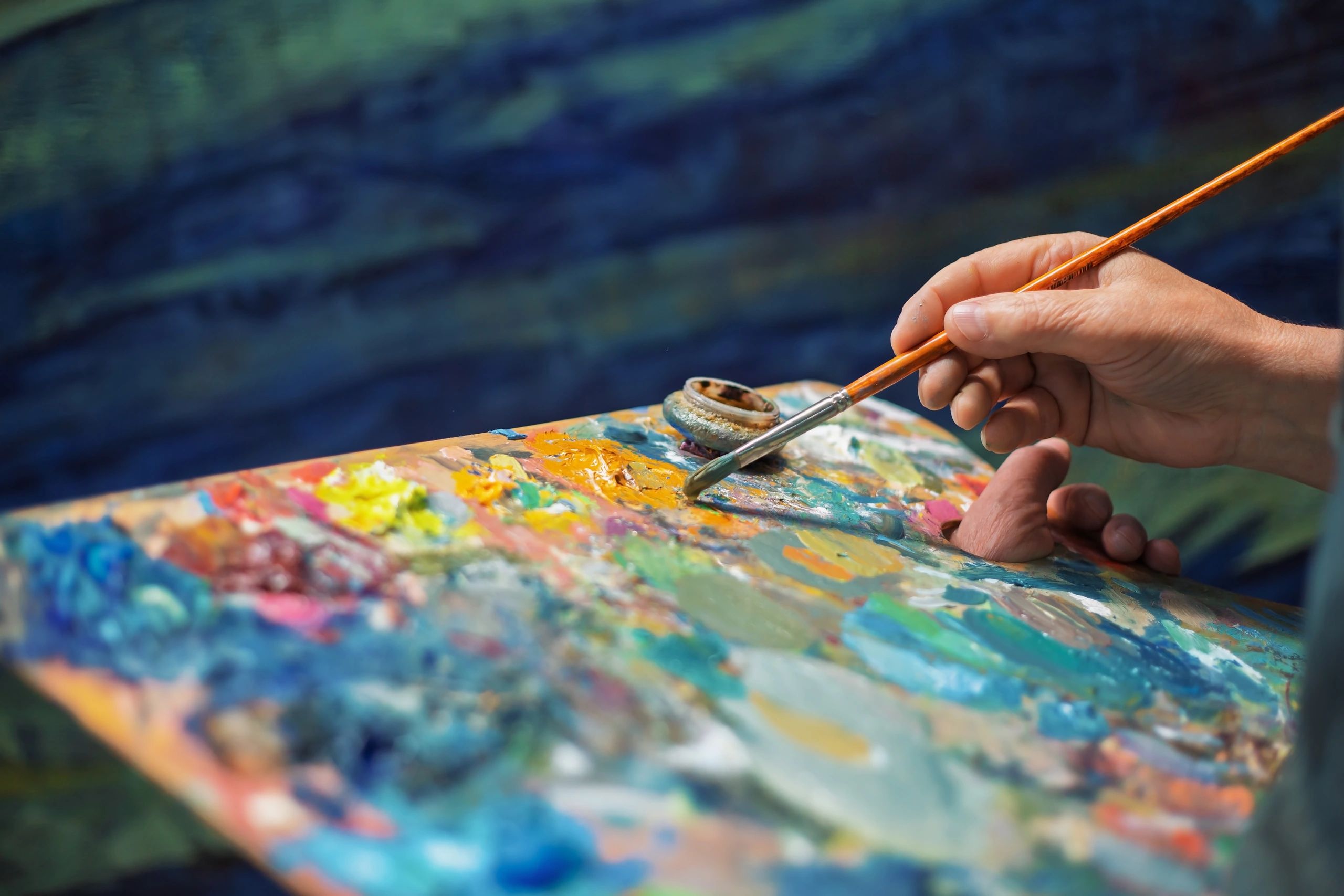 Close-up of paintbrush and palette during painting