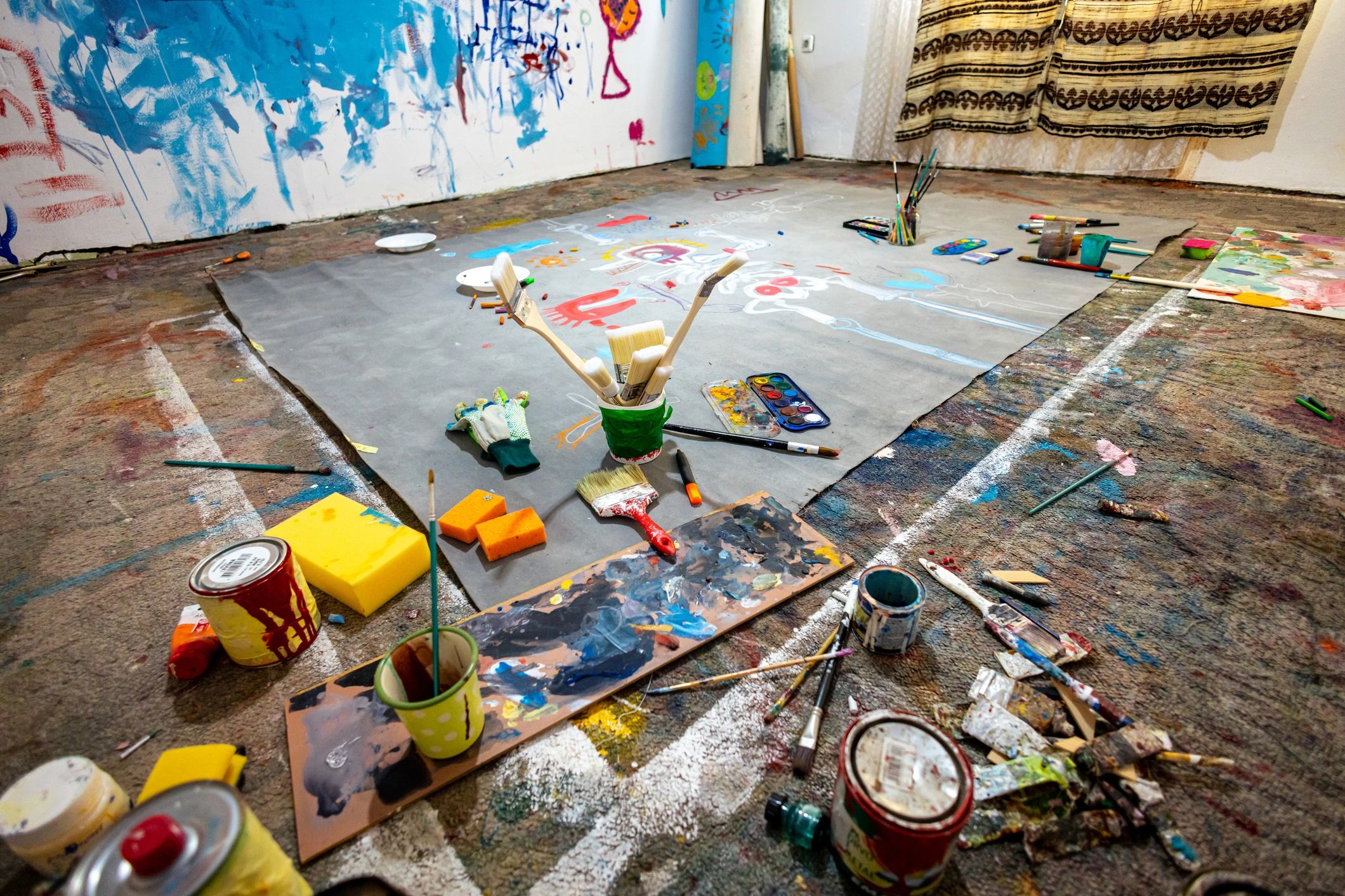 Creative art studio interior with canvas and painting tools
