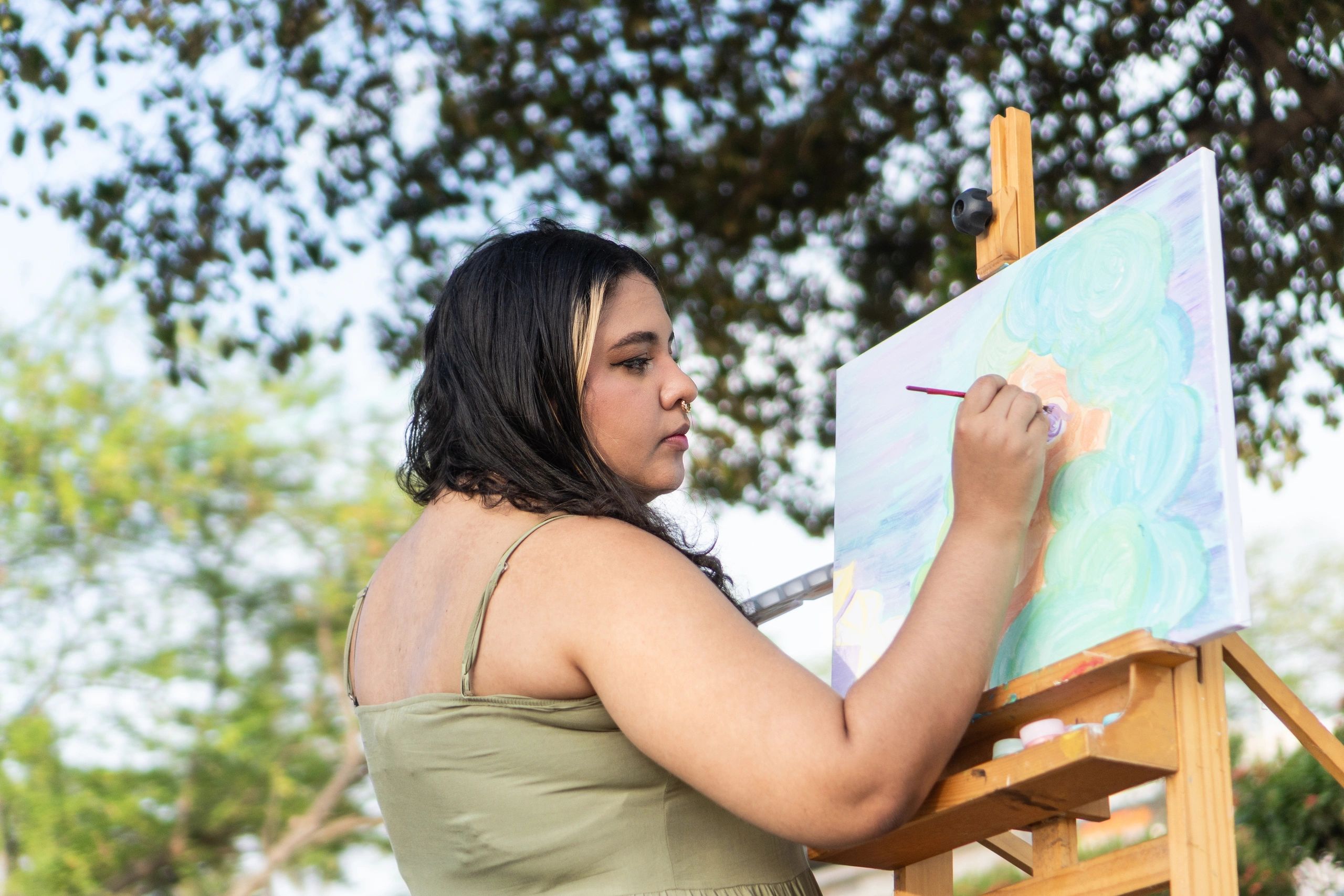 Guest artist painting in a relaxed setting